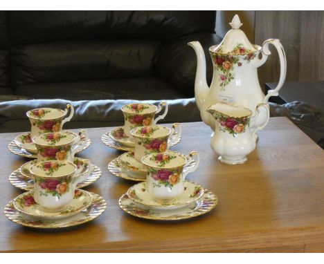 A Royal Albert 'Country Roses' coffee service consisting of, six cups, six saucers, six side plates, milk jug, and coffee pot
