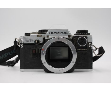 Olympus OM10 SLR Film Camera (Body ONLY) w/ Manual Adapter (Allows User to Change Shutter Speeds)  The camera is WORKING and 