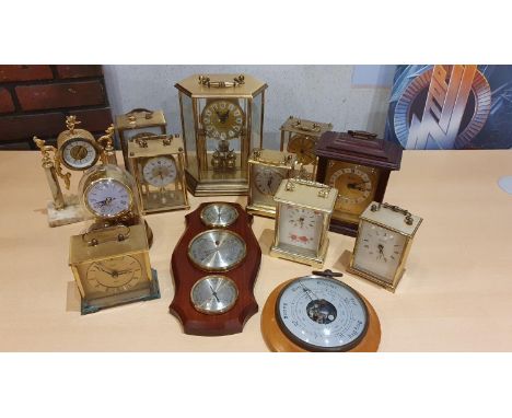 A collection of brass and other carriage clocks and an anniversary clock 