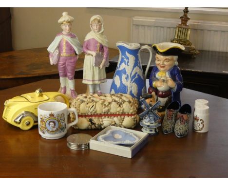 A Sadler racing car teapot in yellow together with a musical Toby jug, blue and white floral claret jug, a pair of continenta