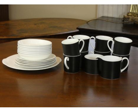 A Susie Cooper Contrast (C2068) including- eight tea cups, seven saucers, six side plates, serving dish, milk jug and sugar b