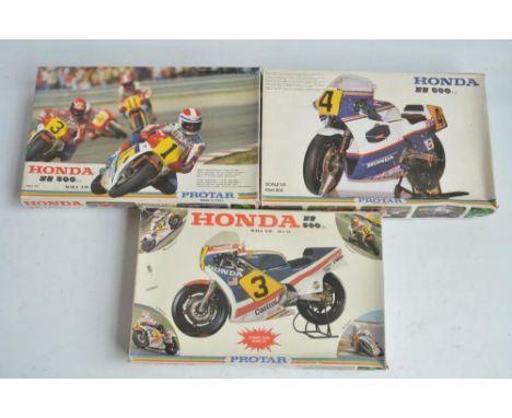 Three unbuilt 1/9 scale plastic Honda NS500 motorbike model kits from Protar. Kits appear complete with all plastic sprues in