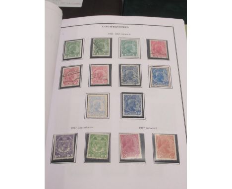 Davo Liechtenstein stamp album, 2 stamp albums cont. various world stamps, Davo USA stamp album and 2 folders cont. USA cover