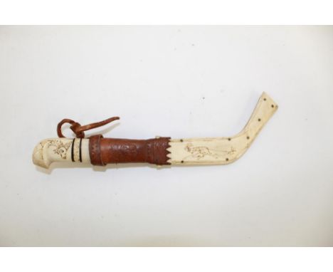 Circa 19th century traditional Lapland Sami Knife, with Reindeer bone handle and sheath, with metal studded fasteners. Embell