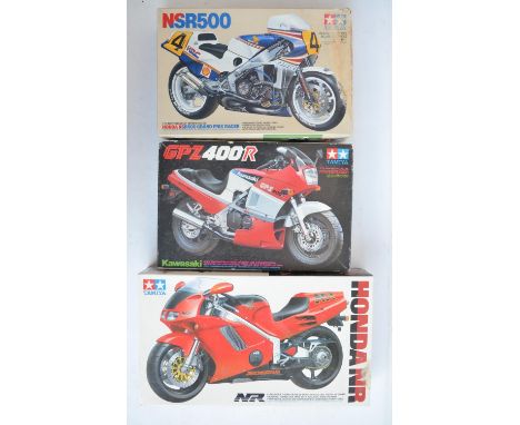 Three unbuilt 1/12 scale plastic model motorcycle kits from Tamiya to include 14060 Honda NR, 1445 Kawasaki GPZ400R (please n