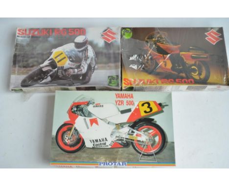 Three unbuilt 1/9 scale plastic motorbike model kits from Protar to include a Suzuki RG500 Marco Lucchinelli and Suzuki RG500