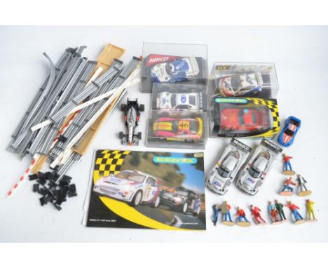 Collection of Scalextric cars and accessories to include 5 cased cars from Fly, Ninco, SCX and Scalextrix including SCX weath