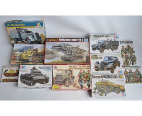 Collection of 11 unstarted 1/35 scale WWII German armour and crew plastic model kits/sets from Tamiya, Italeri, Techmod, Trum