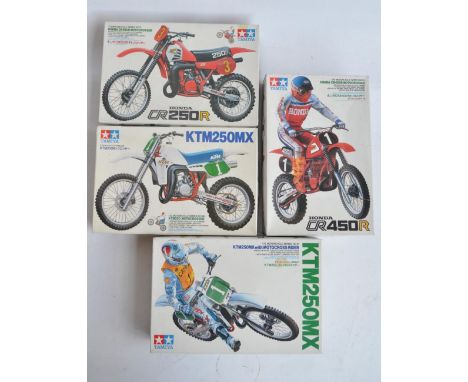 Four 1/12 scale plastic model motorcycle kits from Tamiya to include 1451 KTM250MX with motocross rider (rider partially glue