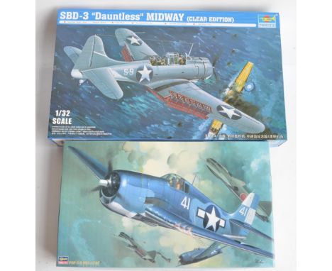 Two unbuilt 1/32 scale US Navy aircraft plastic model kits to include Hasegawa F6F-3/5 Hellcat (ST7) and Trumpeter SBD-3 Daun