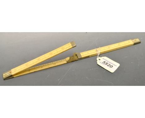 Drawing Instruments - a 24" ivory folding scale rule, four fold, bevelled inside edge, late 19th century