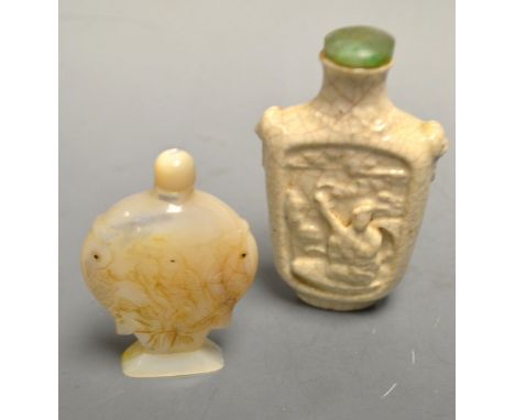 A Chinese pottery snuff bottle, decorated with figures, green stone stopper;  another carved smaller (2)