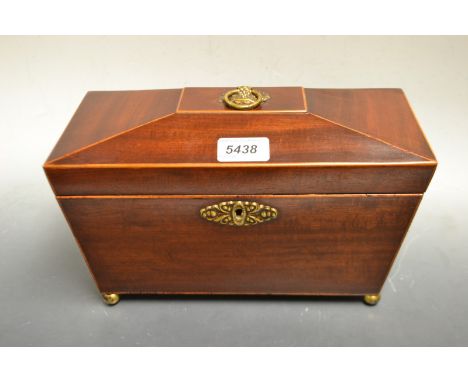 A Victorian mahogany inlaid sarcophagus tea caddy, circa 1880.