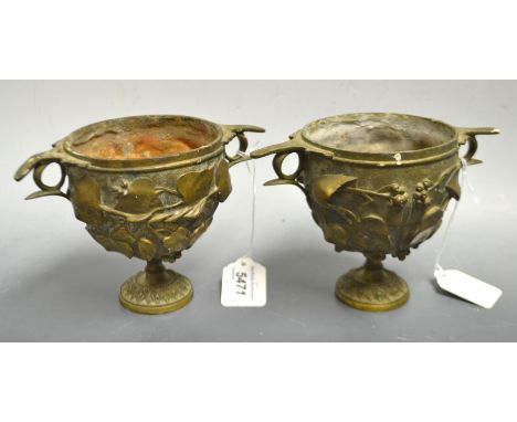 A pair of French patinated Grecian two-handled wine cups or skyphos, boldly cast with vine, spreading circular foot, 12cm hig