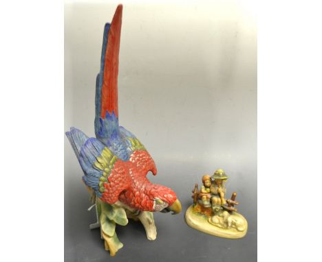 A Goebel Scarlet Macaw;  a Goebel figure, designed by MJ Hummel, Shepherd and Shepherdess (2)