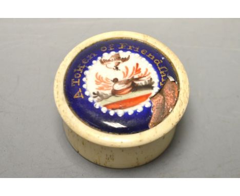 A George III bone and enamel circular box, the push-on cover inset with an enamel plaque inscribed A Token of Friendship, 3.5