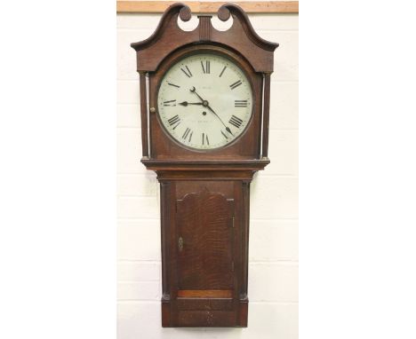 A mid-19th century oak trunk dial wall clock timepiece with weight driven eight day single train movement, the 16-inch painte