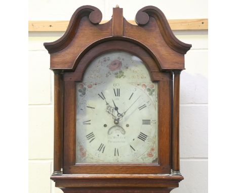 An early 19th century oak longcase clock with thirty hour bell strike movement, the 12-inch painted breakarch dial with subsi