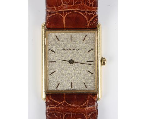 A Jaeger-LeCoultre 18ct gold rectangular cased wristwatch with quartz movement, the signed textured dial with gilt baton hour