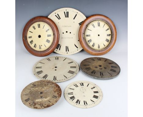 A collection of late Victorian and later mahogany moulded circular wall clock surrounds, together with assorted wall clock be