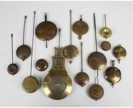 A collection of 19th century and later brass mantel and bracket clock pendulums and parts.Buyer’s Premium 29.4% (including VA