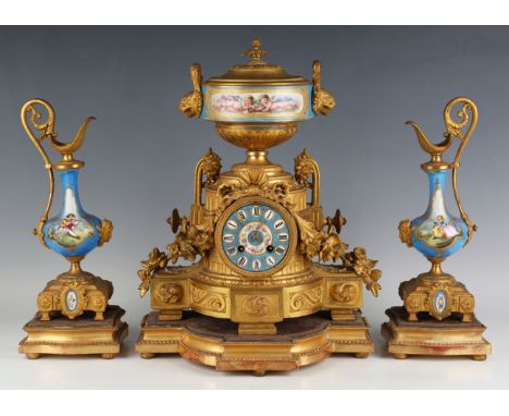 A late 19th century French gilt metal and porcelain mantel clock with eight day movement striking on a bell, the porcelain di