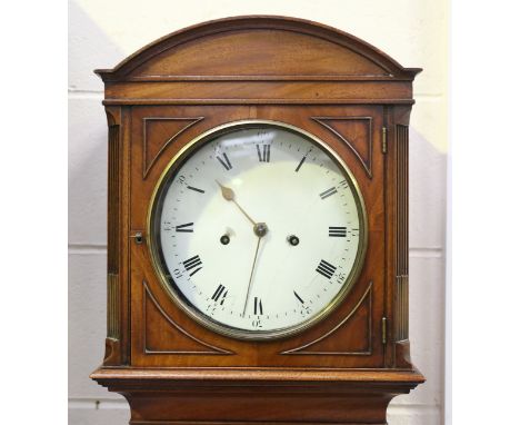 An early 19th century mahogany longcase clock with eight day movement striking hours on a bell, the 9½-inch circular dial wit