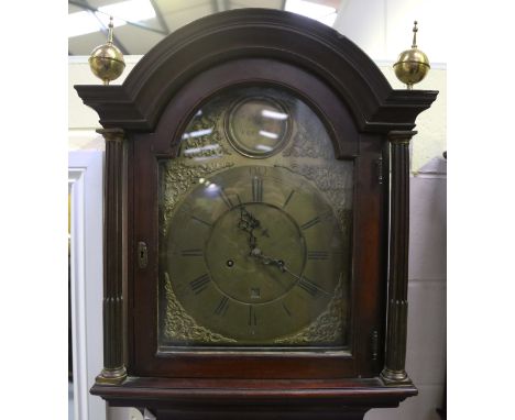 A George III mahogany longcase clock with eight day movement striking on a bell, the 12-inch brass breakarch dial with boss t