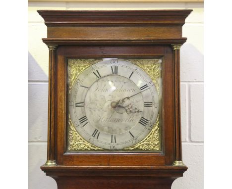 A George III oak longcase clock with thirty hour movement striking on a bell, the 12-inch square dial with silvered chapter r