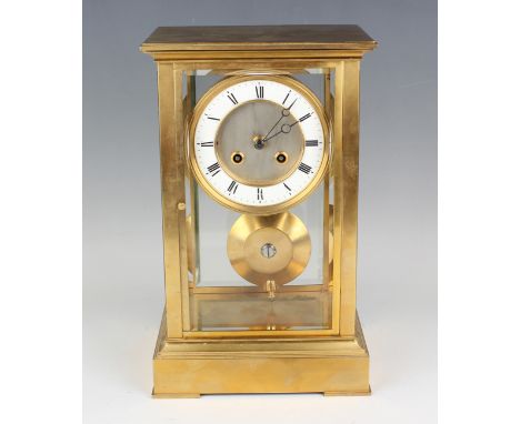 A late 19th/early 20th century lacquered brass four glass mantel clock with eight day movement striking hours and half hours 