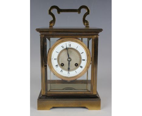 A 20th century French lacquered brass four glass mantel clock, the eight day movement with platform escapement and striking o