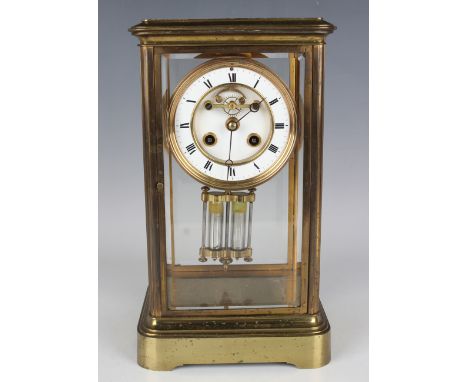 A late 19th/early 20th century French lacquered brass four glass mantel clock with eight day movement striking hours and half