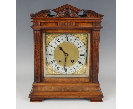 A late 19th century walnut mantel clock with Lenzkirch eight day movement striking on a gong, the square brass dial with matt