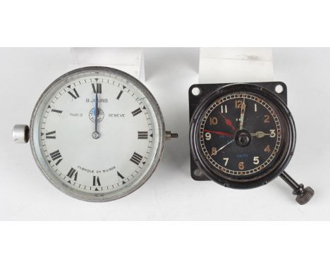 A Jaeger Paris car timepiece with eight day movement, the 3-inch silvered circular dial with black Roman hour numerals and bl