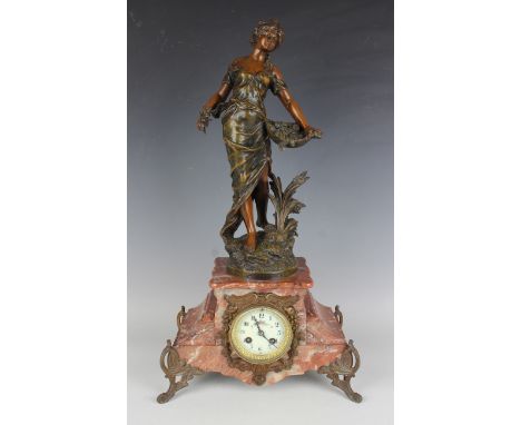 An early 20th century French rouge marble and spelter mantel clock with Japy Frères eight day movement striking on a bell, th