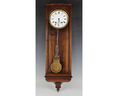 A 19th century rosewood cased Vienna style regulator wall clock with eight day movement striking hours and half hours on a go