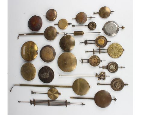 A collection of 19th century and later brass mantel and bracket clock pendulums and bobs.Buyer’s Premium 29.4% (including VAT