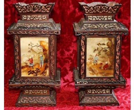 Pair of late 19th century or early 20th century Chinese hanging lanterns with scroll fret cut frame and with four interior pa