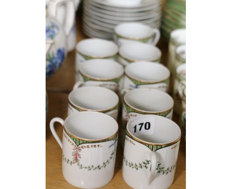 Limoges coffee set with green swag decoration comprising nine coffee cans, thirty saucers and a cream jug.