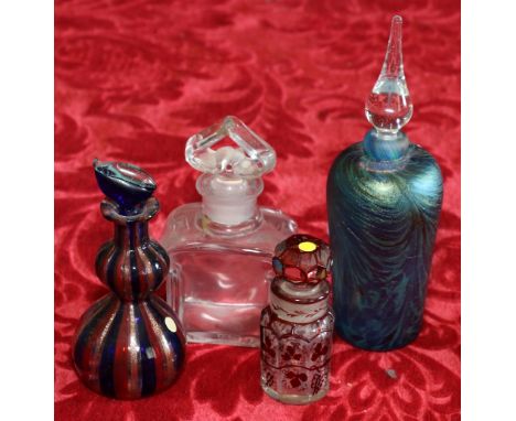Baccarat glass perfume bottle 12cm together with a Bohemian ruby cased perfume bottle, 8.5cm, a Murano glass perfume bottle, 