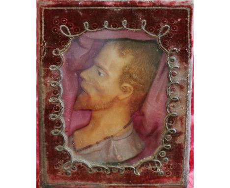 19th century wax relief portrait of a gentleman in red velvet box frame, 14.5cm x 10.5cm CONDITION REPORT: Wax portrait on go