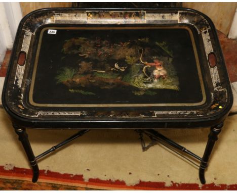 Victorian Anglo Indian toleware tray decorated with a native hunting tiger, 72cm  on a gilt ebonised bamboo stand