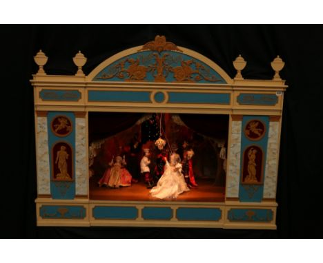 The Menotti Puppet Theatre
with carved figures and others principally characters from his operas, the wooden facade of classi