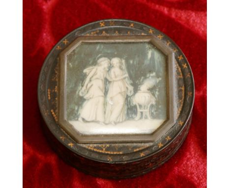 Early 19th century French gilt inlaid tortoiseshell circular snuff box, mounted with ivory panel depicting classical ladies, 