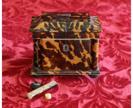 Victorian tortoiseshell and ivory two-division tea caddy of canted rectangular section with four column supports on turned sq