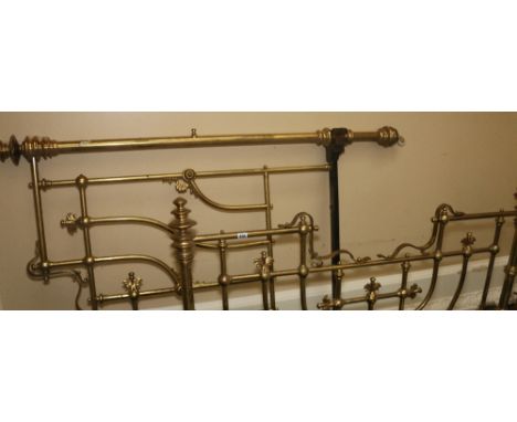 Victorian tubular lacquered brass bed, the frame with chrysanthemum bosses and anthemion terminal raised on square supports, 