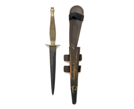 WILKINSON SWORD CO. LTD., LONDON A RARE MKI FAIRBAIRN-SYKES DAGGER, 1941/42, with standard-form double-edged 6 1/2in. reblued