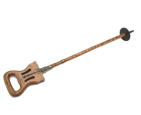 A VINTAGE SHOOTING STICK, with oak folding seat and shaft with mottled bamboo effect, metal fixings, steel spike with fixed f