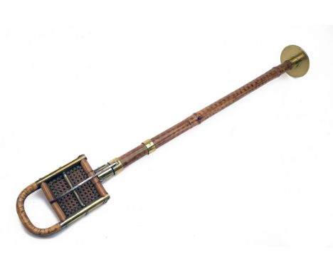 A FRENCH PATENT VINTAGE SHOOTING STICK, with rattan folding seat, brass mounts marked 'BRI S.G.D.G.', bamboo shaft with brass