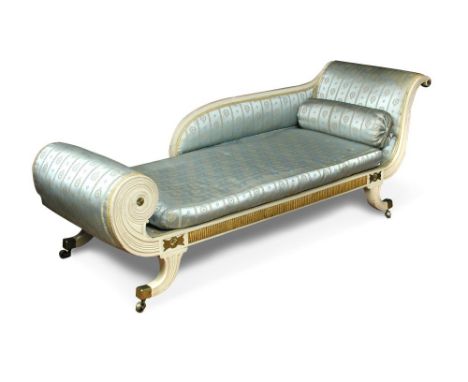 A Regency painted chaise longue with scroll end and parcel gilt decoration, applied brass mounts and upholstered in a woven g
